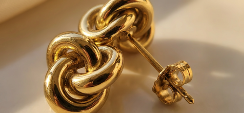 Knot stud earring detail - tarnish-resistant gold stainless steel minimalist design