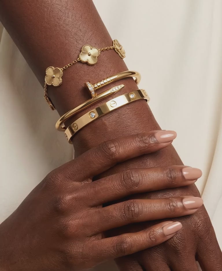  Woman wearing minimal stone-set gold bangle - waterproof stainless steel jewellery South Africa
